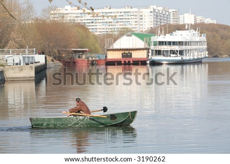 Moscow, Russia, Man in Green Boat Rows Shovel, Springtime on River