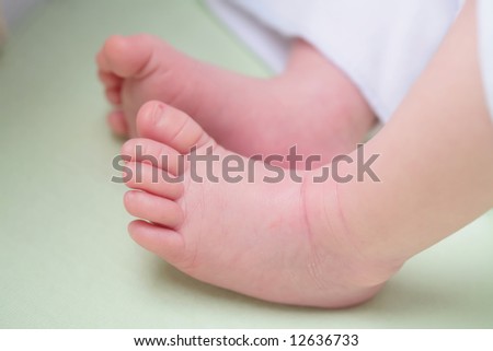 small gentile rose foots of infant, with copy-space