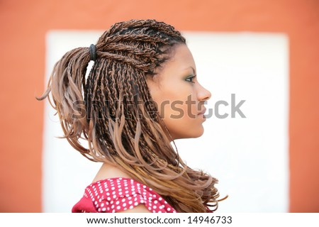 stock photo : portrait of the beautiful african russian girl with luxurious hairstyle on background of