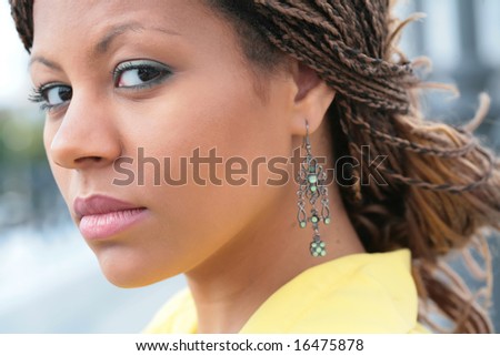 exotic hairstyle. stock photo : close-up portrait african girl with exotic hairstyle in yellow