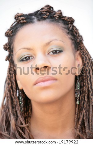 stock photo : beautiful black girl with exotic hairstyle on white background