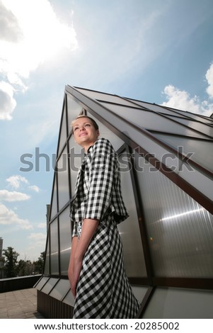 young architect on background of the metallic-glass modern construction