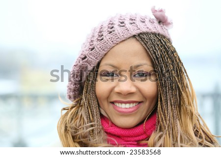 horizontal photo portrait of the smiling woman in the lilac beret