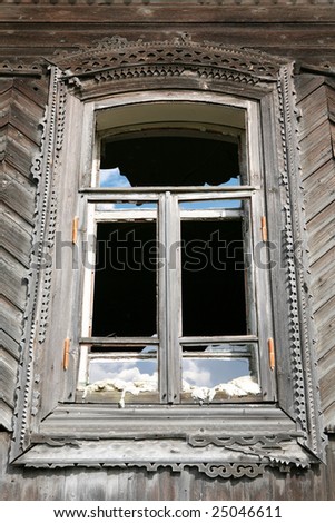 window of the old-time building with splinter glass, Ural culture, Russia,