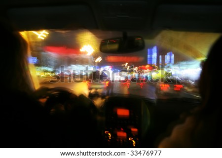 abstraction, blur, varicoloured spots, night type of the town street from car