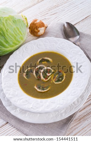 Cabbage soup with meat rolls