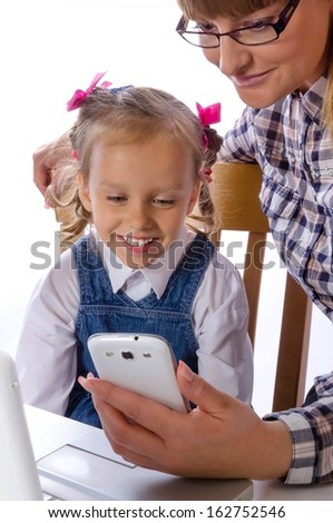 mother and daughter with mobile phone