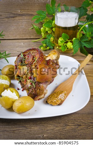 Roasted pork knuckle./ Ham and bacon are popular foods in the west, and their consumption has increased with industrialisation.