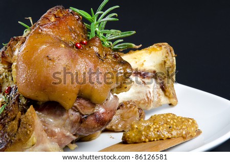 Roasted pork knuckle. Ham and bacon are popular foods in the west, and their consumption has increased