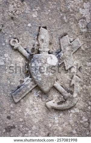 The very old christian symbol - Heart with Cross and Anchor. Every object has its unique meaning. Heart means love, cross means faith and anchor - hope.