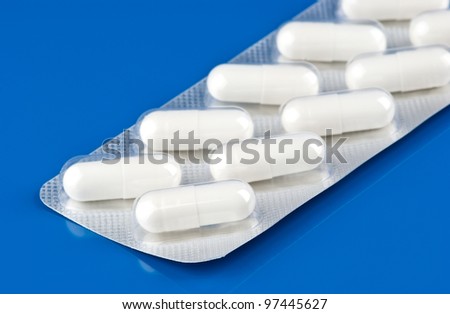 Pills pack on blue background
