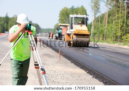 Surveyor Engineer Making Measuring With Theodolite Instrument Equipment During Construction Road Works