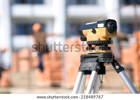 Land surveying equipment theodolite at construction site