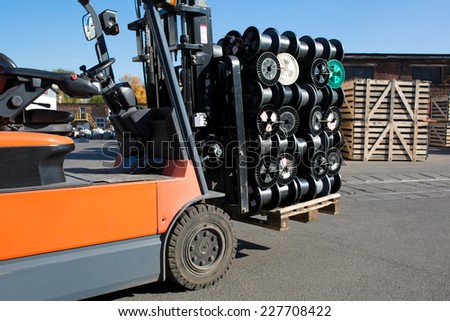 Factory Forklift Truck Stacker Transporting Cargo to Warehouse