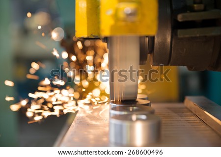 metalworking industry: finishing metal working on horizontal surface grinder machine with flying sparks