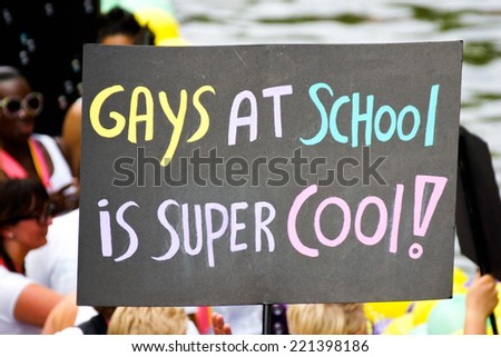 AMSTERDAM - THE NETHERLANDS, July 31, 2009: Pro \'Gays A School\' sign at the Amsterdam Gay Pride in The Netherlands, on July 31, 2009