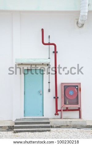 Fire hose cabinet with wall and exit door