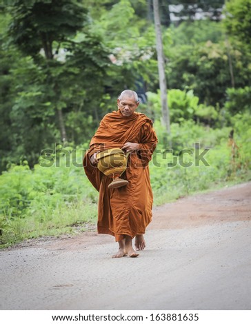 Loei province , Thailand - JULY 18: Every day very early in the morning, Thai people donated food to the monks on july 18, 2013 in Loei province , Thailand