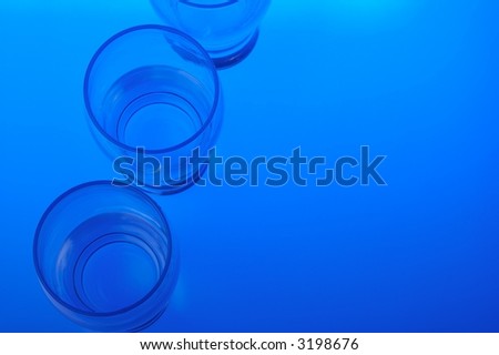 Liquid filled glasses with blue backlighting.