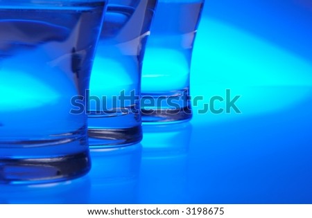 Liquid filled glasses with blue backlighting.