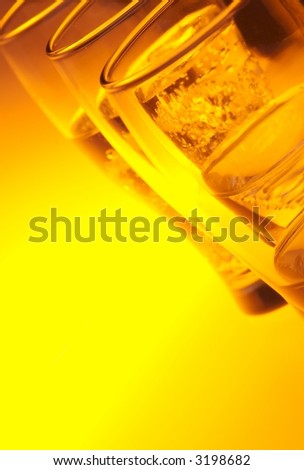 Liquid filled glasses with yellow backlighting.