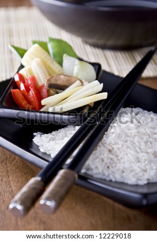 Rice and Vegetables on a plate with chopsticks. A health meal.