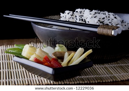Rice and Vegetables on a plate with chopsticks. A health meal.