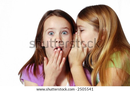 stock photo Two girls sharing secrets