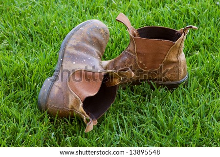 Battered Old Work Boots on Lawn
