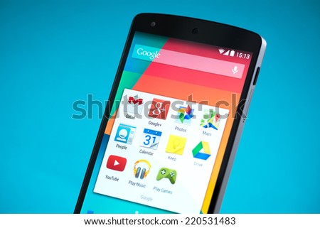 Kiev, Ukraine - September 22, 2014: Close-up shot of brand new Google Nexus 5, powered by Android 4.4 version, manufactured by LG Electronics. Isolated on blue background.