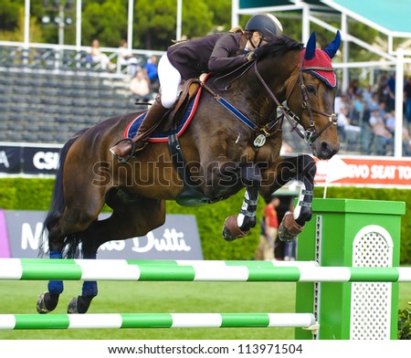 BARCELONA- SEPTEMBER 21: Anna Gronzina in action during the CSIO 101th International jumping competition in Real Club Polo Barcelona, on September 21, 2012, Barcelona, Spain.