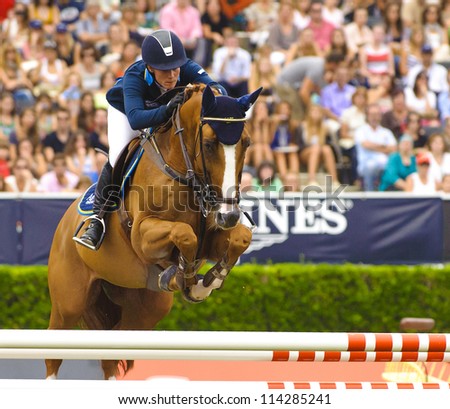 BARCELONA - SEPTEMBER 23: Angelica Augustsson in action during the CSIO 101th International jumping competition in Real Club Polo Barcelona, on September 23, 2012, Barcelona, Spain.