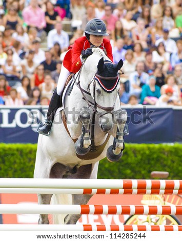 BARCELONA - SEPTEMBER 23: Courtney Vince in action during the CSIO 101th International jumping competition in Real Club Polo Barcelona, on September 23, 2012, Barcelona, Spain.
