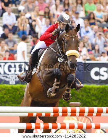 BARCELONA - SEPTEMBER 23: Anna Gronzina in action during the CSIO 101th International jumping competition in Real Club Polo Barcelona, on September 23, 2012, Barcelona, Spain.