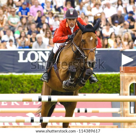 BARCELONA - SEPTEMBER 23: Jesus Garmendia rider in action during the CSIO 101th International jumping competition in Real Club Polo Barcelona, on September 23, 2012, Barcelona, Spain.