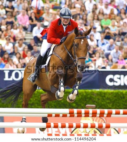 BARCELONA - SEPTEMBER 23: Vladimir Beletsky rider in action during the CSIO 101th International jumping competition in Real Club Polo Barcelona, on September 23, 2012, Barcelona, Spain.