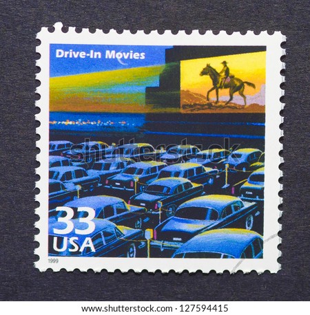 UNITED STATES  -CIRCA 1999: A postage stamp printed in USA showing an image of a fifties drive-in movie theater, circa 1999.