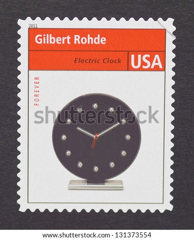 UNITED STATES - CIRCA 2011: a postage stamp printed in USA showing an image of a retro electric clock made by the industrial designer Gilbert Rohde, circa 2011.