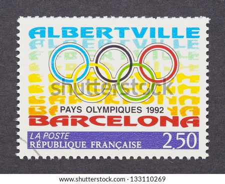 FRANCE - CIRCA 1992: a postage stamp printed in France showing an image of five olympic rings and names of the 1992 olympic cities Barcelona and Abertville, circa 1992.