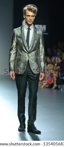 MADRID - SEPTEMBER 16: French model Clement Chabernaud model walks on the Victorio & Lucchino  catwalk during the Cibeles Madrid Fashion Week runway on September 16, 2011 in Madrid.
