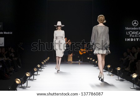 MADRID - FEBRUARY 20: Models walking on the Duyos catwalk during the Cibeles Madrid Fashion Week runway on February 20, 2013 in Madrid.