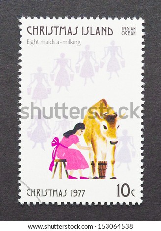 CHRISTMAS ISLAND - CIRCA 1977: a postage stamp printed in Christmas Island showing an image of eight maids milking the eight gift from the Twelve Days of Christmas, circa 1977.