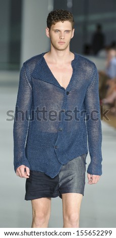 BARCELONA - JULY 11: A model walks on the Josep Abril catwalk during the 080 Barcelona Fashion runway on July 11, 2013 in Barcelona, Spain.