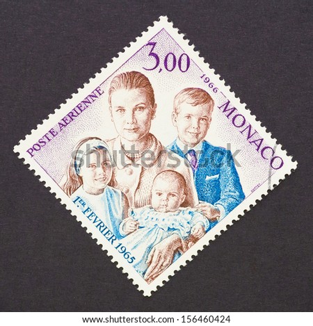 MONACO - CIRCA 1966: a postage stamp printed in Monaco showing an image of Grace Kelly an her children princess Caroline, prince Albert II and princess Stephanie, circa 1966.