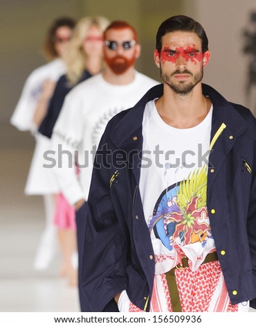 BARCELONA - JULY 09: Models walking on the Brain & Beast catwalk during the 080 Barcelona Fashion runway on July 09, 2013 in Barcelona, Spain.