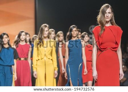 MADRID FEBRUARY 17 models walking on the Juanjo Oliva catwalk during the Mercedes-Benz Fashion Week Madrid Fall Winter 2014-2015 runway on February 17 2014 in Madrid MADRID FEBRUARY 17 models walking on the Juanjo Oliva catwalk during the Mercedes-Benz Fashion Week Madrid Fall Winter 2014-2015 runway on February 17 2014 in Madrid