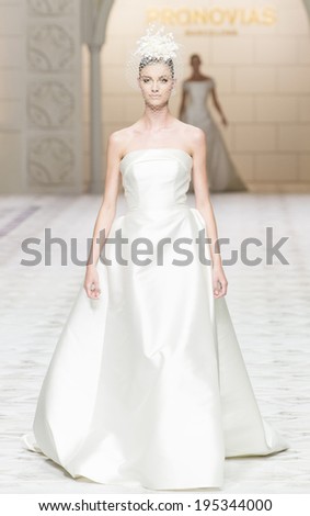 BARCELONA - MAY 09: A model walks on the Pronovias bridal collection 2015 catwalk during the Barcelona Bridal Week runway on May 09, 2014 in Barcelona, Spain.
