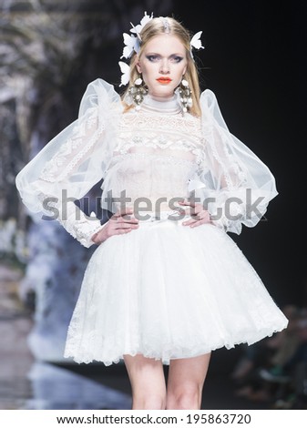 BARCELONA - MAY 07: a model walks on the Yolan Cris bridal collection 2015 catwalk during the Barcelona Bridal Week runway on May 07, 2014 in Barcelona, Spain.
