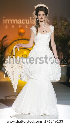 BARCELONA - MAY 07: a model walks on the Inmaculada Garcia bridal collection 2015 catwalk during the Barcelona Bridal Week runway on May 07, 2014 in Barcelona, Spain.