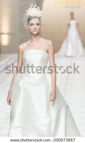 BARCELONA - MAY 09: a model walks on the Pronovias bridal collection 2015 catwalk during the Barcelona Bridal Week runway on May 09, 2014 in Barcelona, Spain.